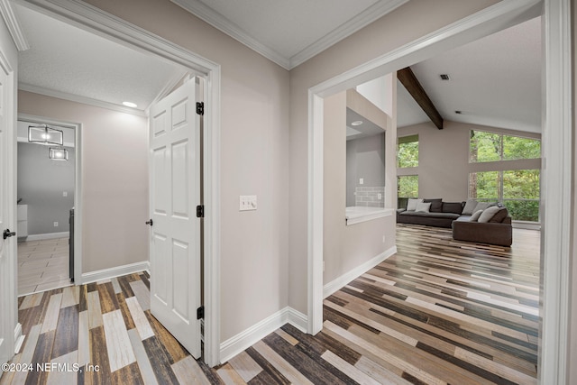 hallway featuring vaulted ceiling with beams, wood-type flooring, and ornamental molding