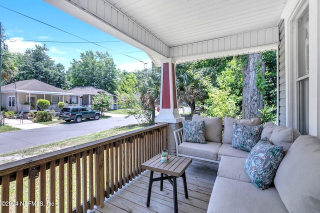 wooden terrace with a porch