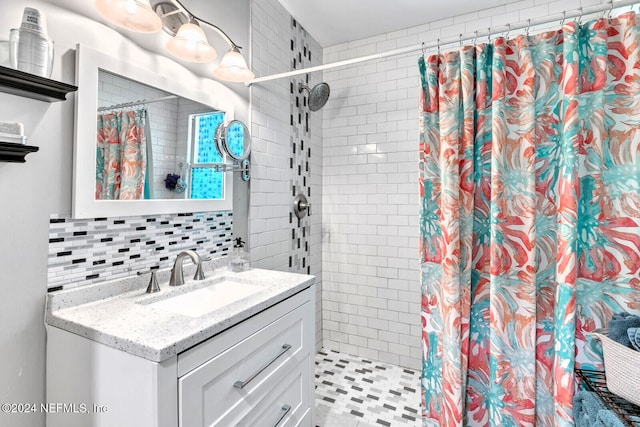 bathroom with a shower with curtain, tile patterned flooring, decorative backsplash, vanity, and tile walls