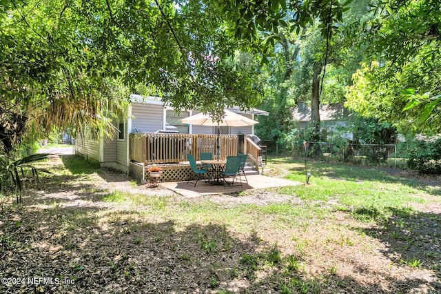 view of yard with a deck