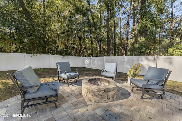 view of patio featuring an outdoor fire pit