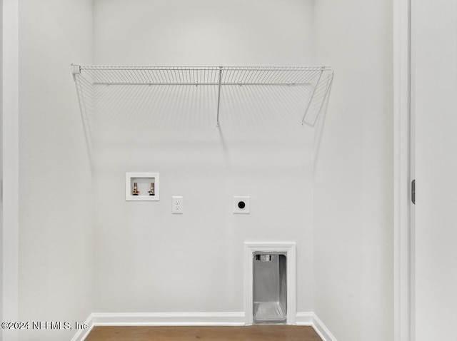 clothes washing area featuring hookup for an electric dryer, wood-type flooring, and hookup for a washing machine