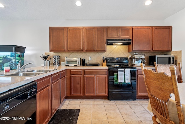 kitchen with tasteful backsplash, sink, light tile patterned floors, and black appliances