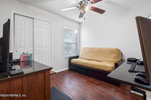 office with ceiling fan, dark hardwood / wood-style flooring, and a textured ceiling