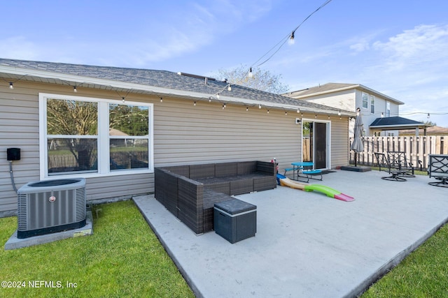 back of property featuring central AC, an outdoor living space, and a patio