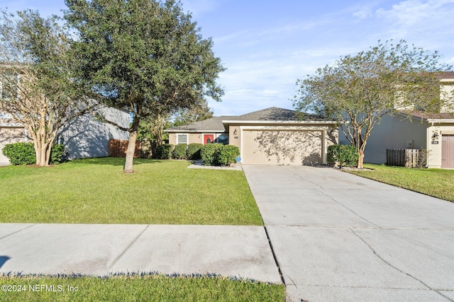 ranch-style house with a front lawn and a garage