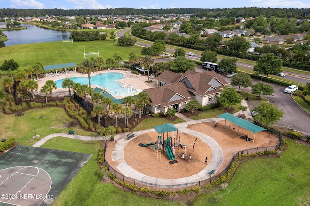 birds eye view of property with a water view