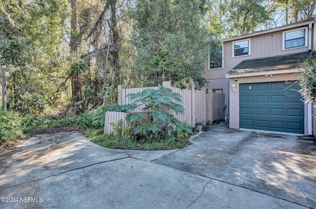 view of side of property featuring a garage