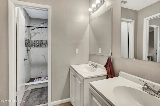 bathroom featuring vanity and an enclosed shower