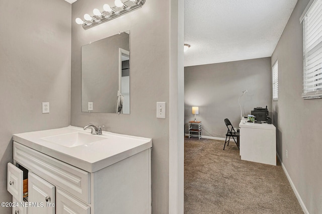 bathroom with vanity and a textured ceiling