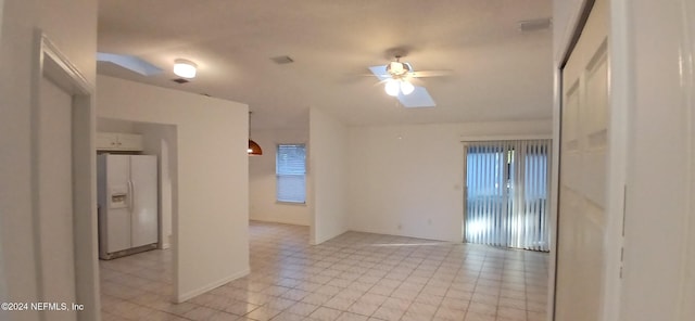 tiled empty room with ceiling fan