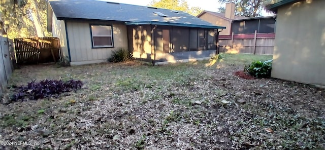 back of house with a sunroom