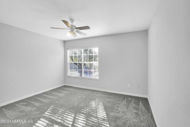 spare room with carpet and ceiling fan