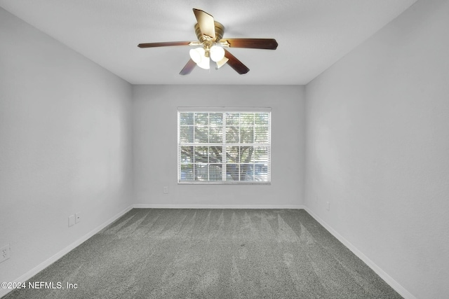 spare room with carpet and ceiling fan