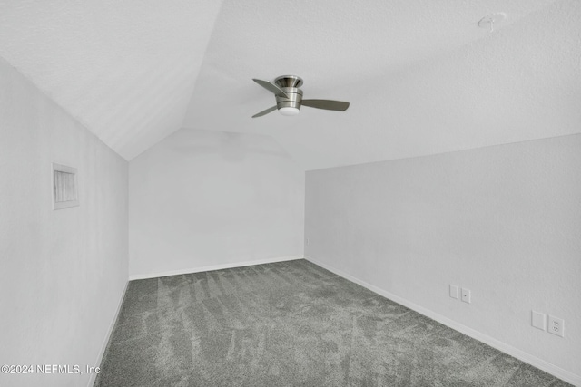 bonus room featuring carpet, ceiling fan, a textured ceiling, and vaulted ceiling