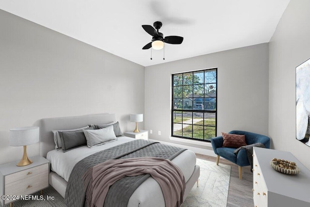 bedroom featuring ceiling fan and light hardwood / wood-style flooring