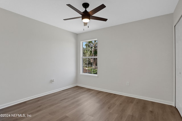 spare room with ceiling fan and hardwood / wood-style floors