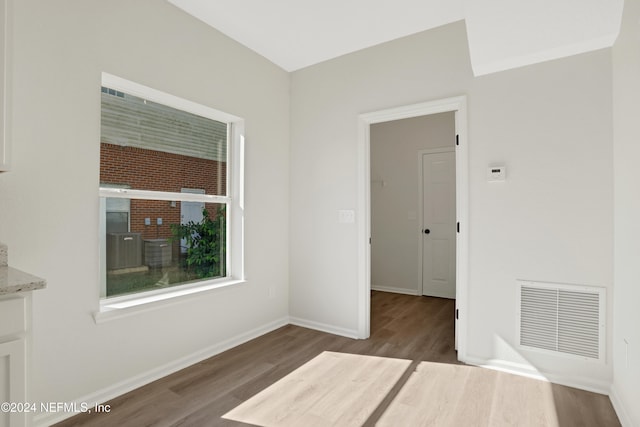 unfurnished room featuring hardwood / wood-style flooring