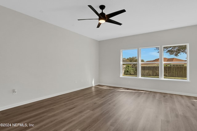 spare room with ceiling fan and wood-type flooring