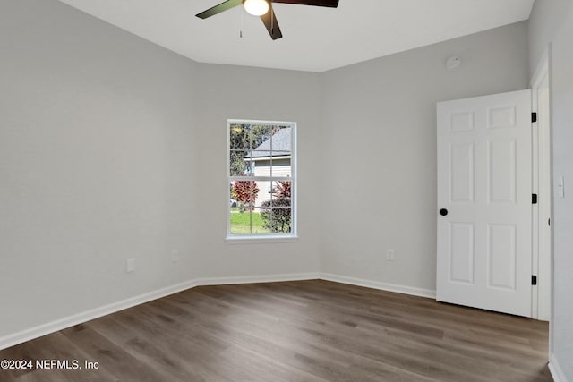 empty room featuring dark hardwood / wood-style floors and ceiling fan