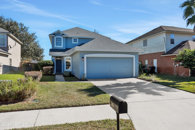 front facade featuring a garage and a front lawn