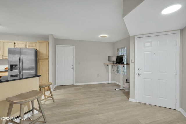 foyer entrance with light wood-type flooring