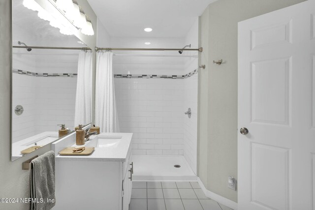 bathroom featuring a shower with curtain, tile patterned flooring, and vanity