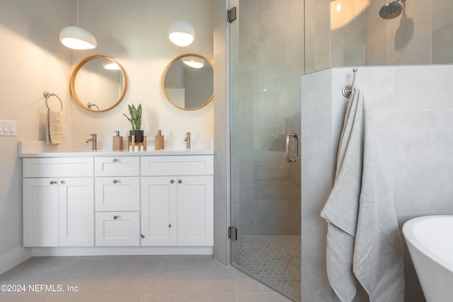 bathroom featuring vanity, tile patterned floors, and independent shower and bath