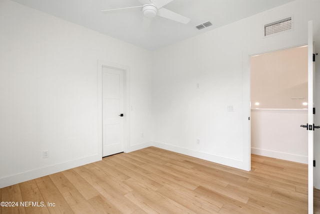 spare room with ceiling fan and light hardwood / wood-style flooring