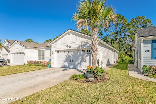 view of front of house with a garage and a front lawn