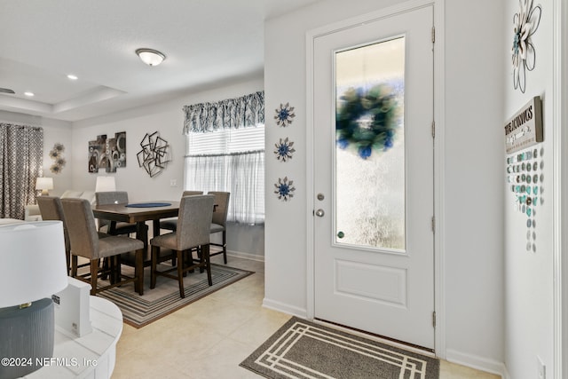 foyer featuring light tile patterned flooring