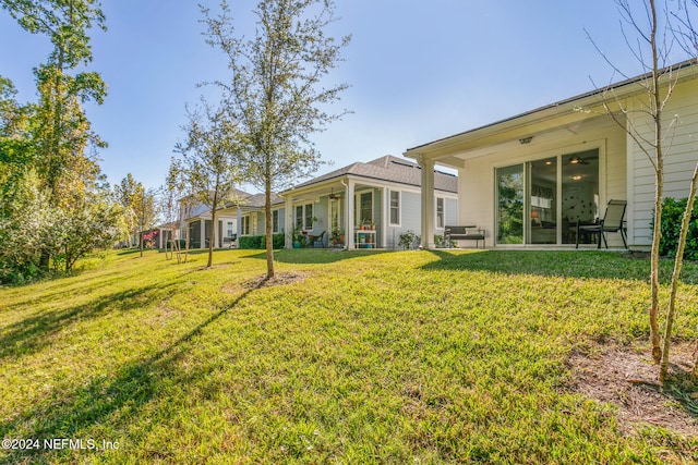 view of yard with ceiling fan