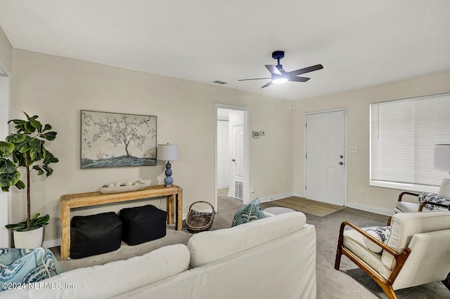 living room with carpet floors and ceiling fan