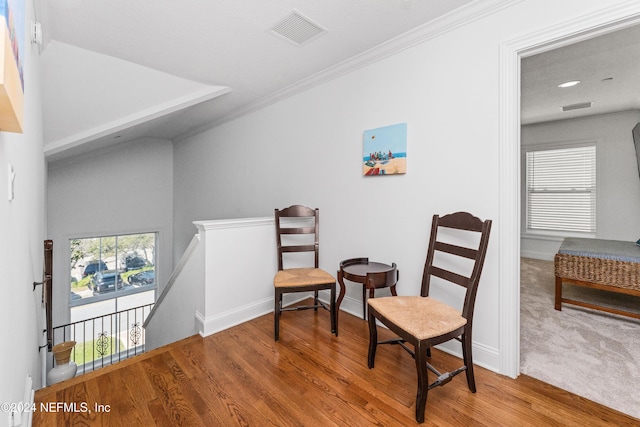 1869 S 2nd St, Jacksonville Beach, FL 32250 - sitting room featuring an upstairs landing, wood finished floors, baseboards, and ornamental molding