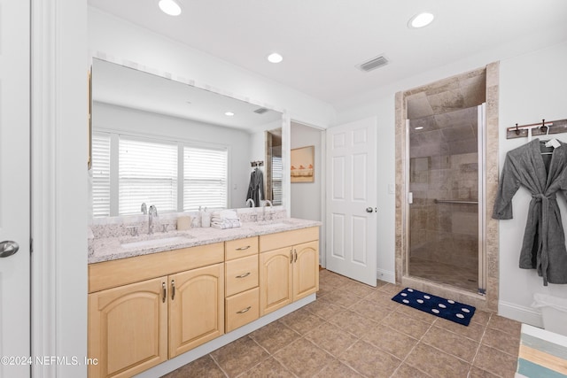 1869 S 2nd St, Jacksonville Beach, FL 32250 - full bath with a shower stall, double vanity, recessed lighting, tile patterned flooring, and baseboards