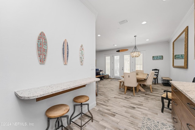 1869 S 2nd St, Jacksonville Beach, FL 32250 - dining area with recessed lighting, light wood-style flooring, baseboards, a chandelier, and ornamental molding