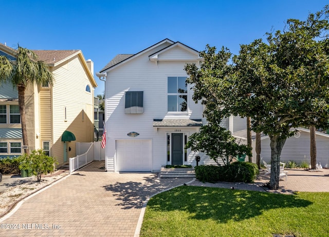 1869 S 2nd St, Jacksonville Beach, FL 32250 - traditional-style home with decorative driveway, an attached garage, and roof with shingles