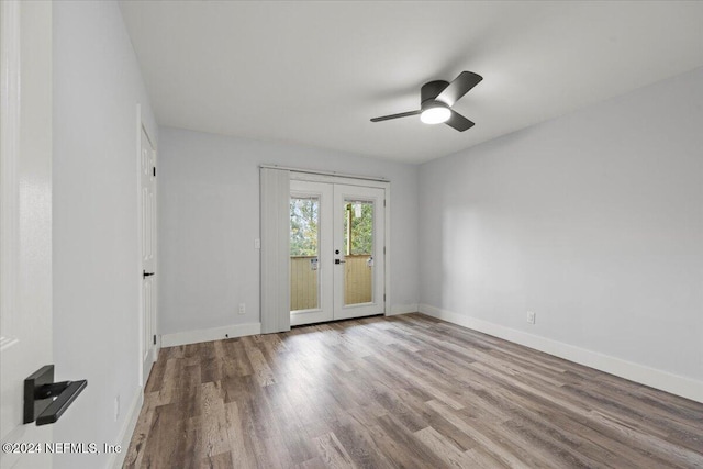 unfurnished room featuring ceiling fan, light wood-type flooring, and french doors