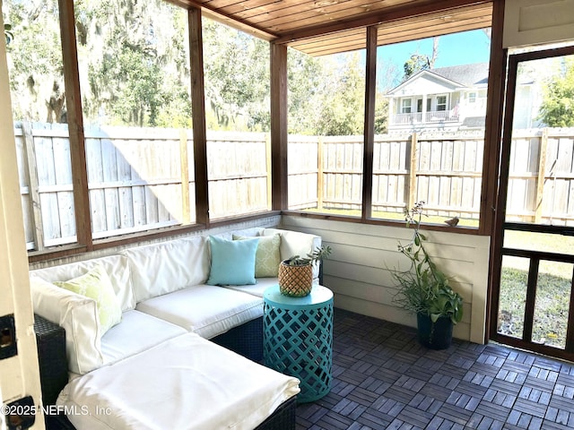 sunroom featuring wooden ceiling