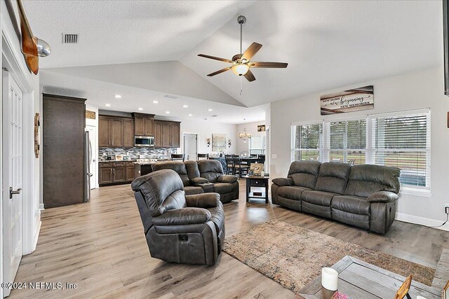 11018 Seneca Ln, Glen St Mary, FL 32040 - living room with ceiling fan, light wood-type flooring, and high vaulted ceiling