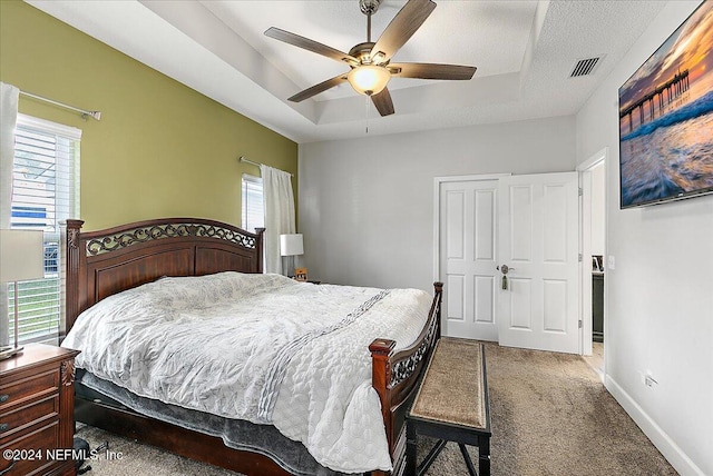 11018 Seneca Ln, Glen St Mary, FL 32040 - bedroom with a raised ceiling, carpet flooring, baseboards, and ceiling fan