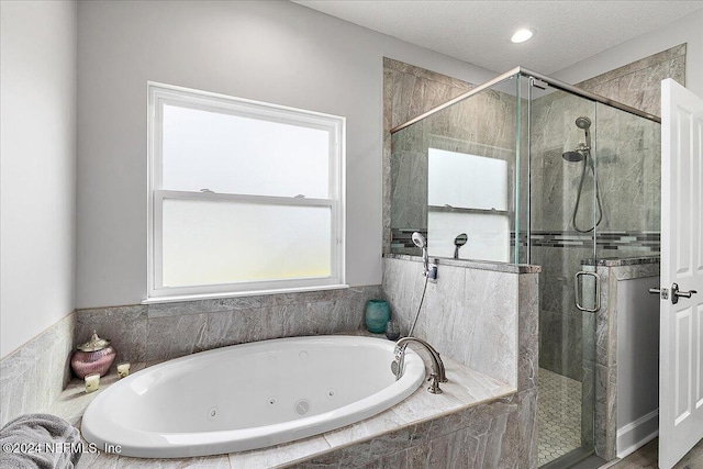 11018 Seneca Ln, Glen St Mary, FL 32040 - bathroom featuring a tub with jets and a shower stall