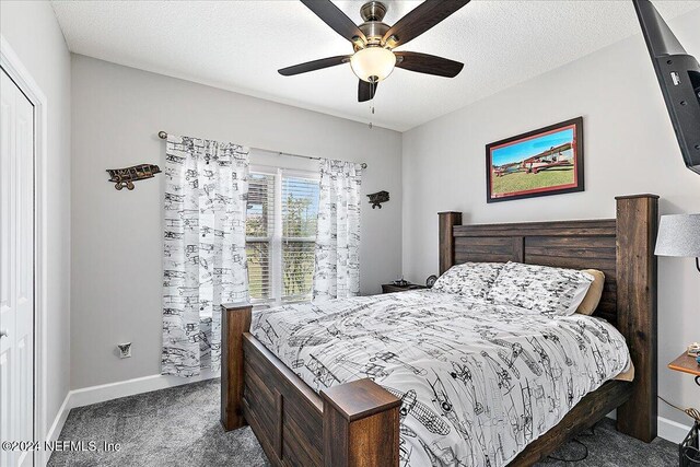 11018 Seneca Ln, Glen St Mary, FL 32040 - bedroom with carpet, baseboards, and a ceiling fan