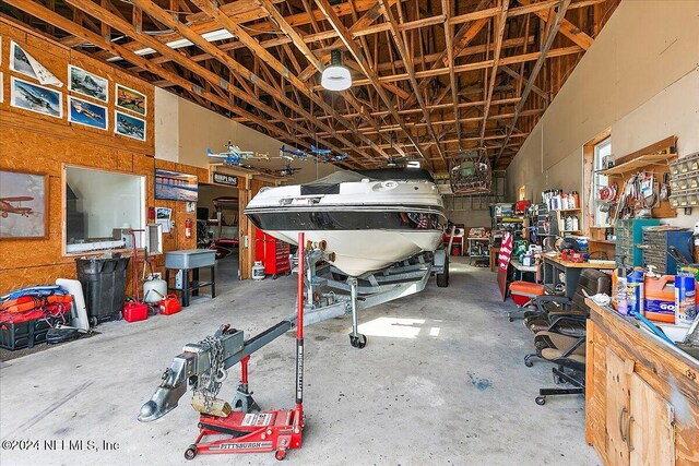 11018 Seneca Ln, Glen St Mary, FL 32040 - garage featuring a workshop area