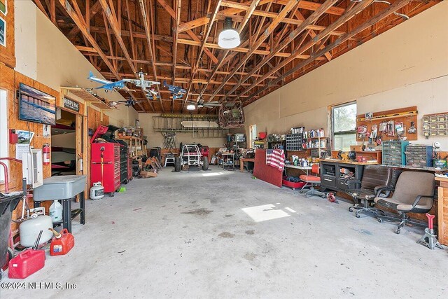 11018 Seneca Ln, Glen St Mary, FL 32040 - garage featuring a workshop area