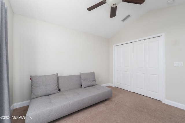 living area featuring carpet, visible vents, vaulted ceiling, and baseboards