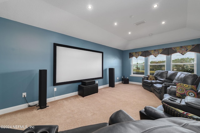 carpeted home theater with baseboards, visible vents, vaulted ceiling, and recessed lighting