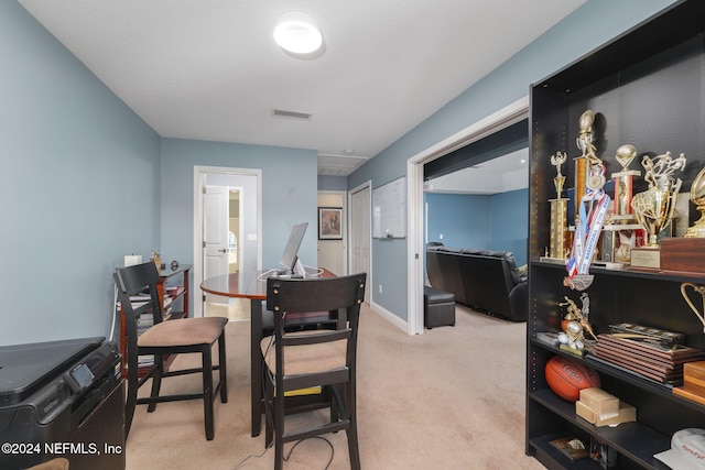 dining room with visible vents and light carpet