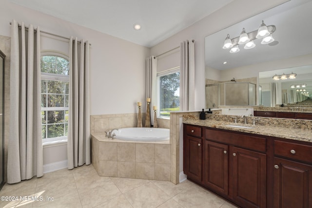 full bath featuring a stall shower, a healthy amount of sunlight, and tile patterned floors