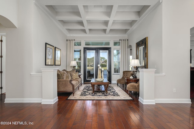 living area featuring baseboards, arched walkways, and dark wood-type flooring